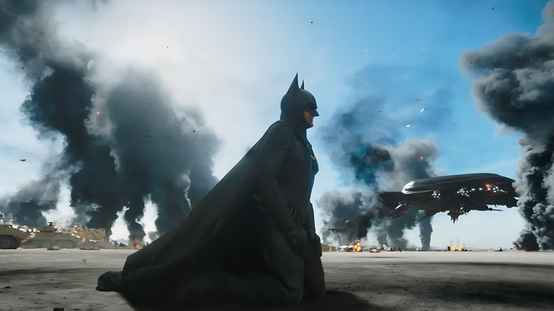 Batman kneeling on battlefield