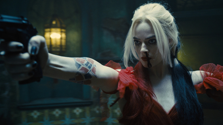 Harley Quinn pointing gun