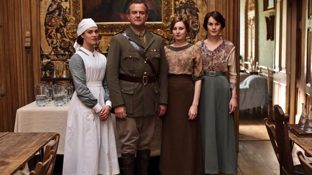 Jessica Brown Findlay as Sybil, Laura Carmichael as Edith, Michelle Dockery as Mary, and Hugh Bonneville as Robert Crawley in Downton Abbey