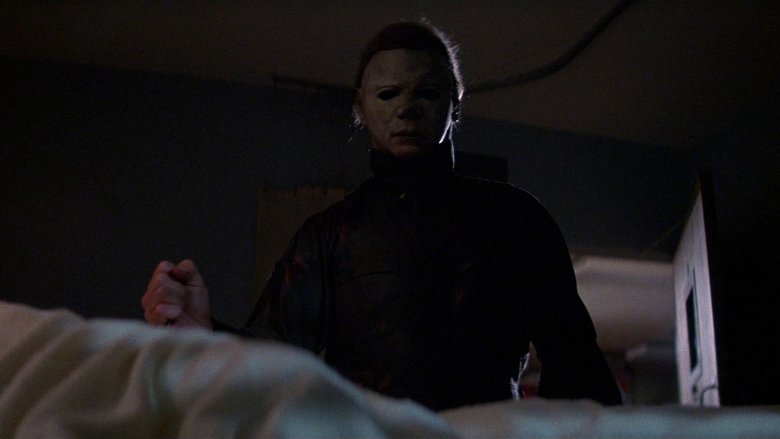 Michael Myers standing over bed