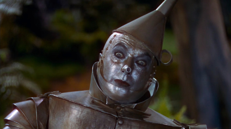 The Tin Man sitting in the forest