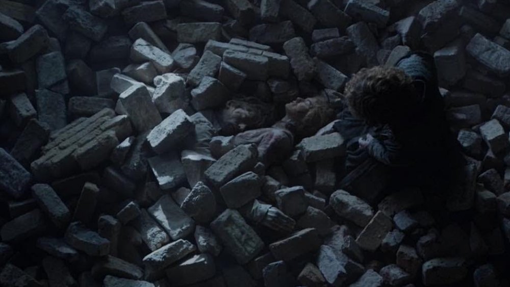 Peter Dinklage  as Tyrion Lannister, discovering the bodies of Jaime and Cersei in the rubble of the Red Keep in Game of Thrones