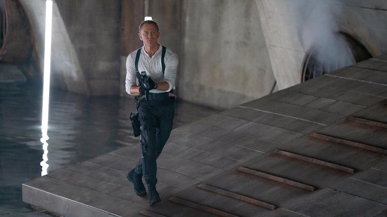 Bond holding a gun on a mission