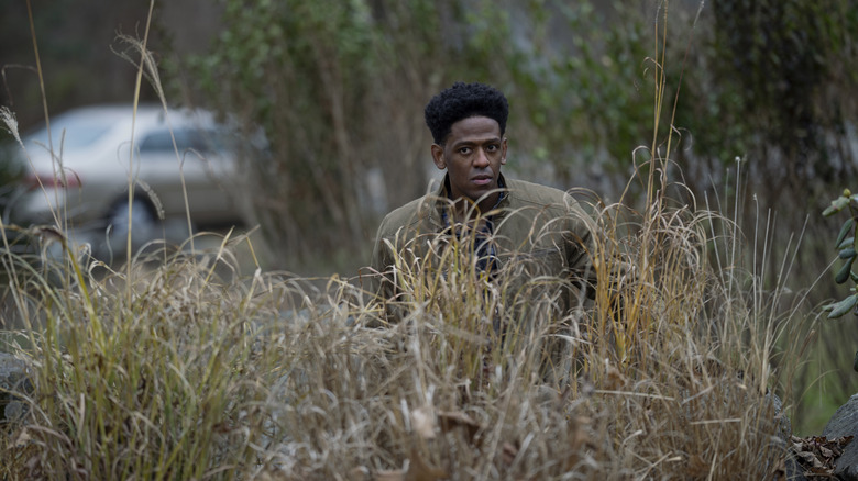 Adrian standing in grass