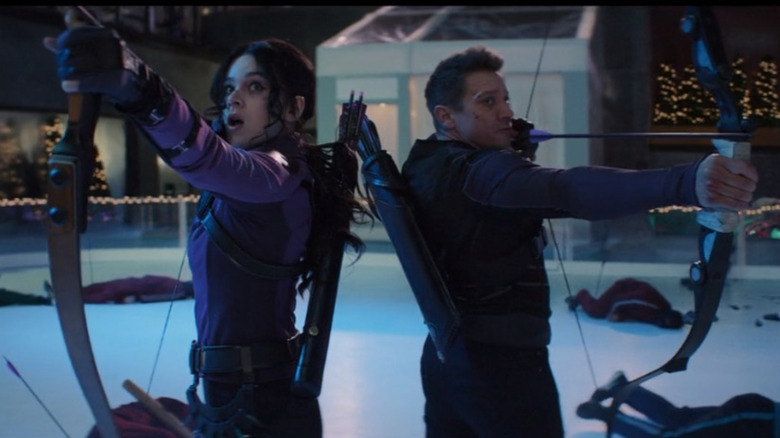 Kate Bishop and Clint Barton shooting arrows