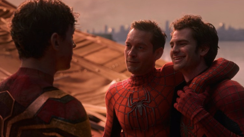 Tobey, Andrew, and Tom smiling at each other