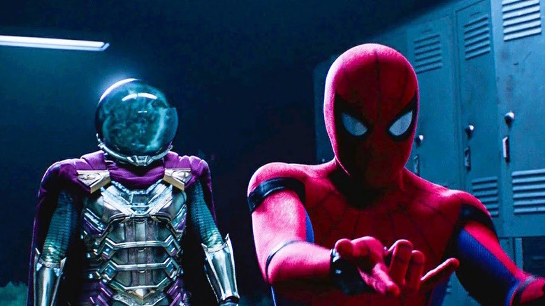 Spider-Man makes web-shooting motion as Mysterio stands behind him