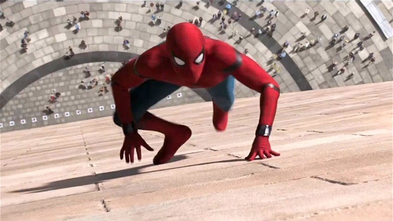 Spider-Man running up the side of a building