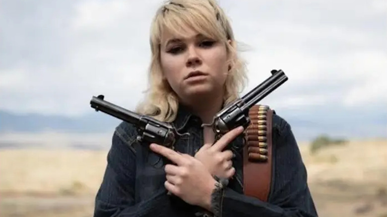 Hannah Gutierrez-Reed poses with weapons