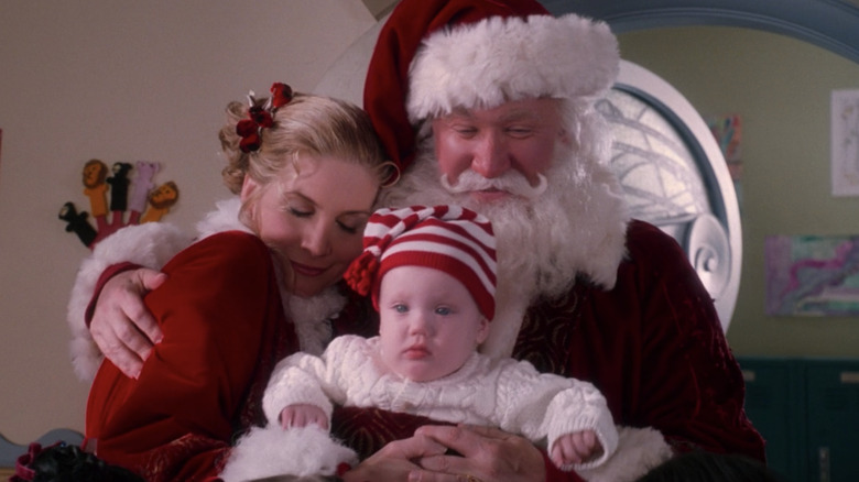 Santa and Mrs. Claus with child