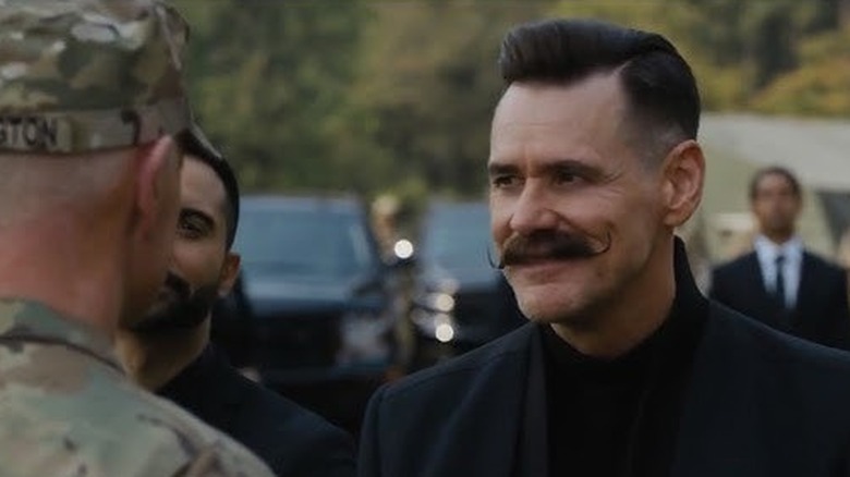 Dr. Robotnik smirks at a soldier in "Sonic the Hedgehog" (2020)