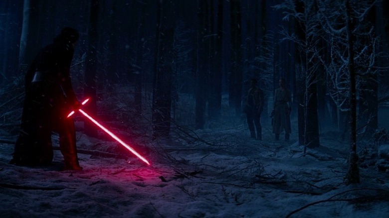 Kylo Ren holding red lightsaber with cross guard