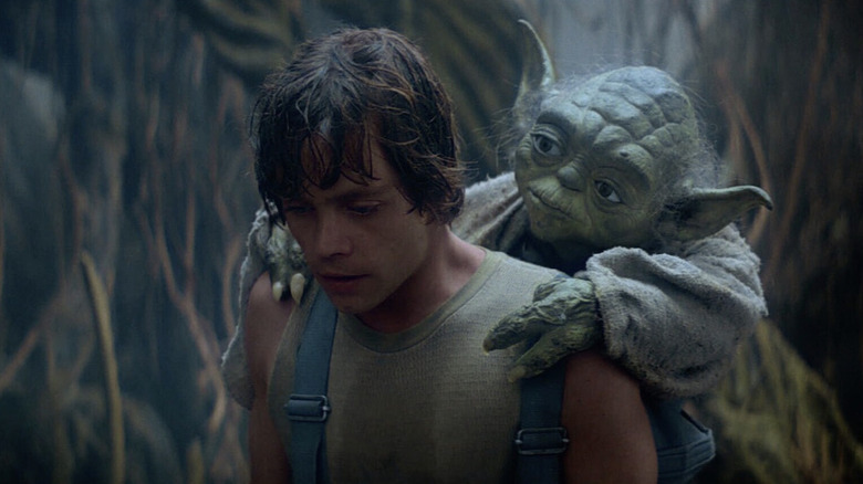 Luke carries Yoda on back