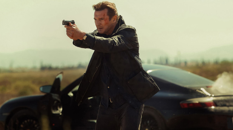 Liam Neeson aiming a gun