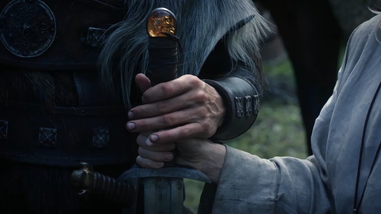 Uhtred gripping sword hilt