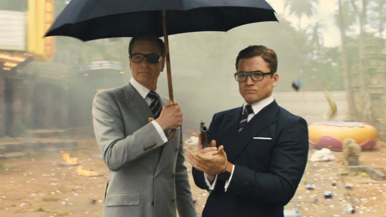 Harry and Eggsy under umbrella