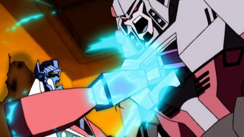 Optimus shoots Megatron's chest