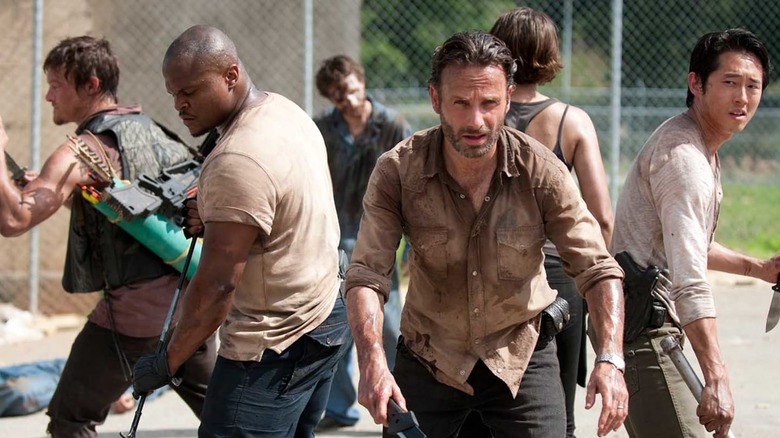 Rick and group fighting zombies