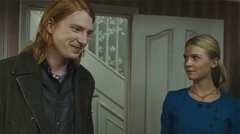 Bill Weasley and Fleur Delacour, both smiling