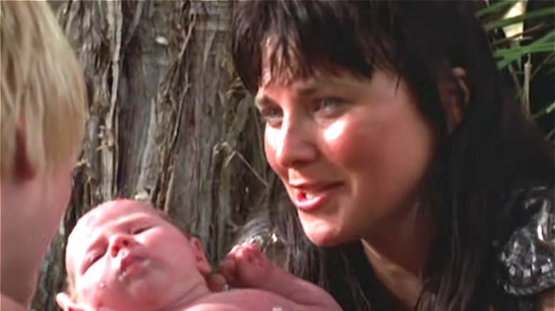 Xena holds baby Eve