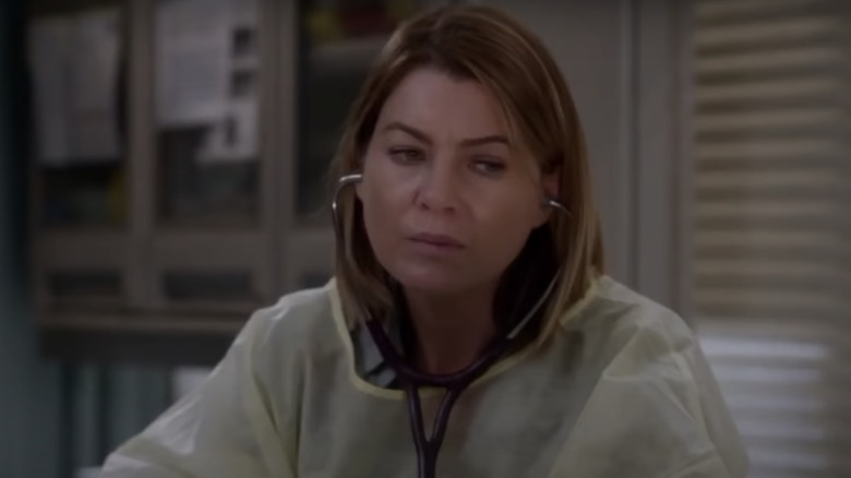 Meredith Grey somber in hospital room