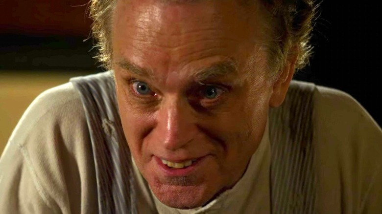 Brad Dourif smiling creepily