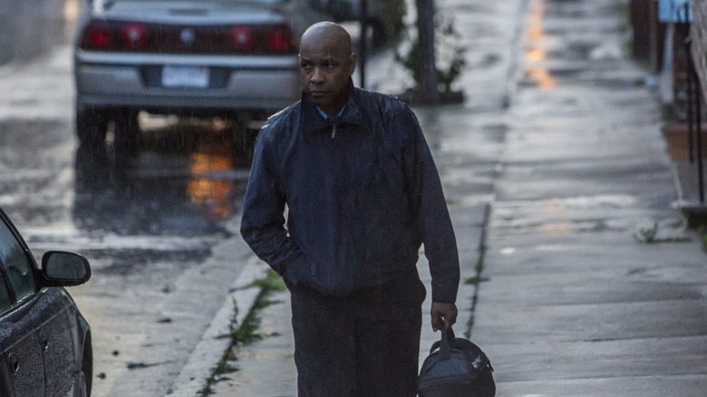 Robert walking in the rain