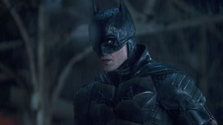 Batman grimacing in the rain