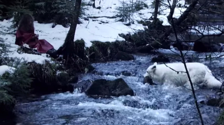 Young Misha and a wolf during a reenactment 