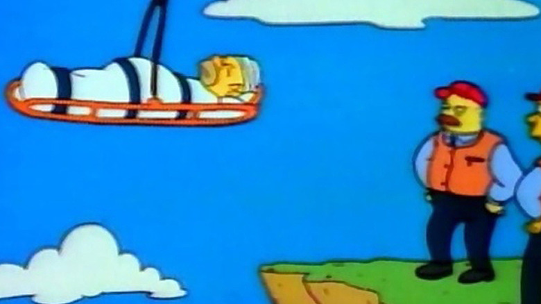 Homer Simpson being airlifted in stretcher