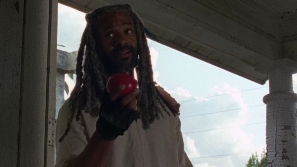 King Ezekiel (Khary Payton) holds a pomegranate on The Walking Dead