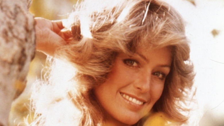 Farrah Fawcett turns her head and smiles