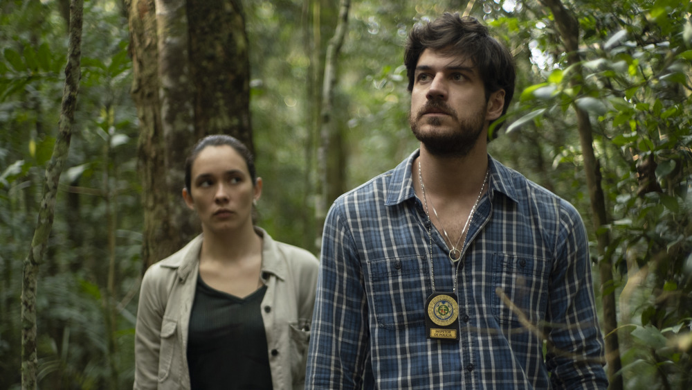 Eric and his partner Marcia walking through the woods