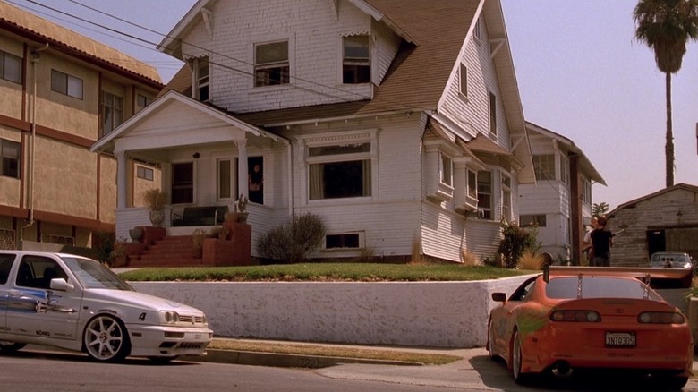 Two cars outside the Toretto home