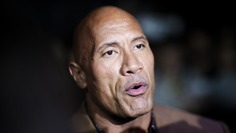 Dwayne Johnson talks to reporters