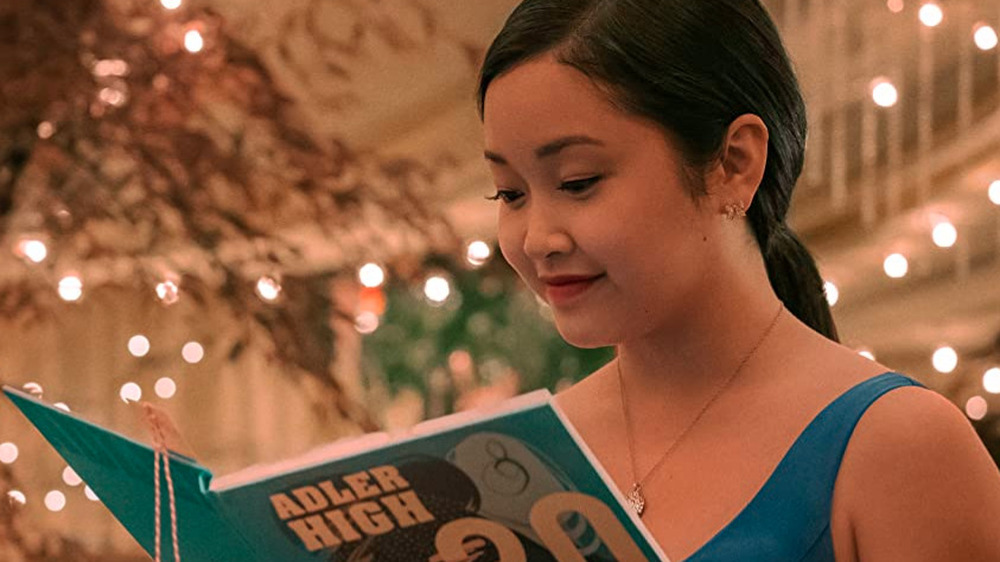 Lara Jean reading a yearbook