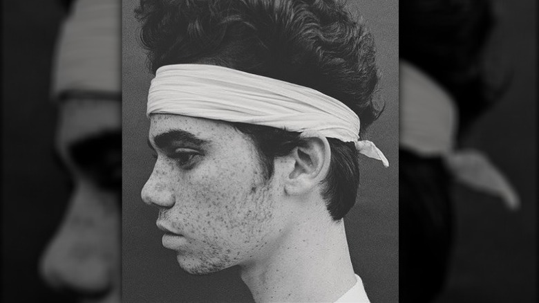 Cameron Boyce wearing white headband