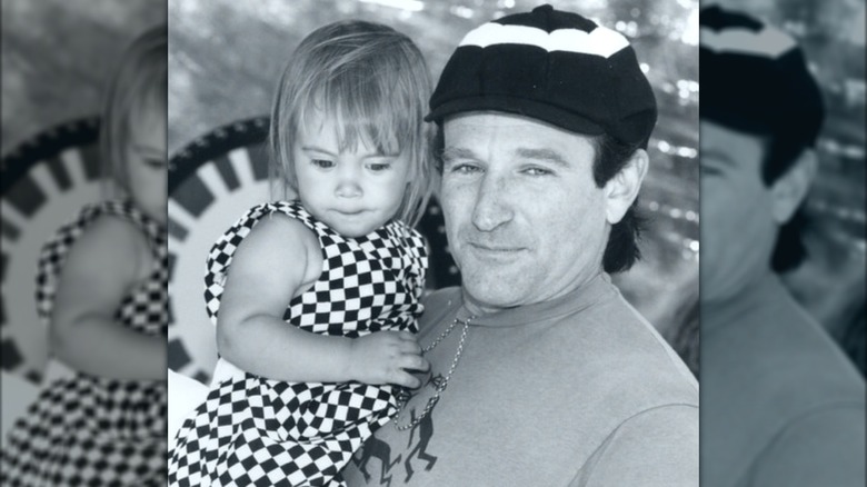 Robin Williams holding Zelda Williams