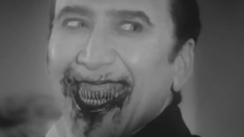 Dracula smiles with fangs