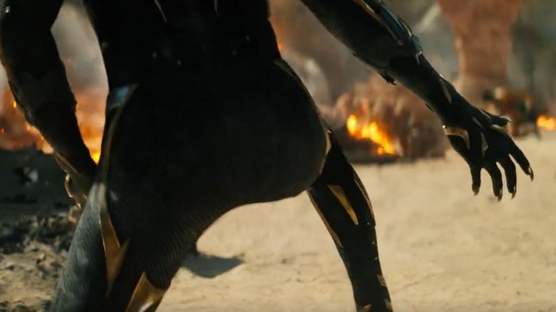 Killmonger suit battling on a beach