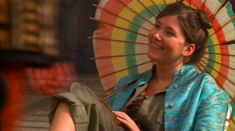 Firefly character Kaylee smiling with parasol