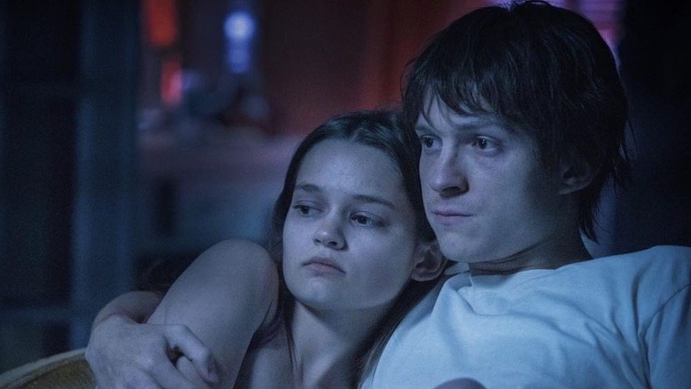 Ciara Bravo and Tom Holland snuggling in one of the quieter moments in Cherry