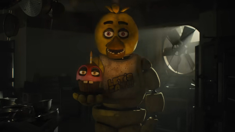 Chica holding Mr. Cupcake