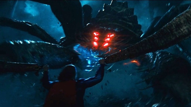 Superman fighting giant spider