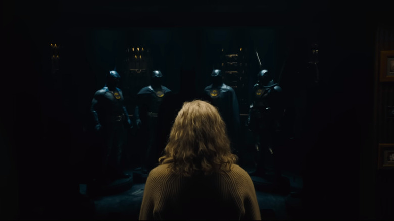 Blonde woman stares at Bat suits