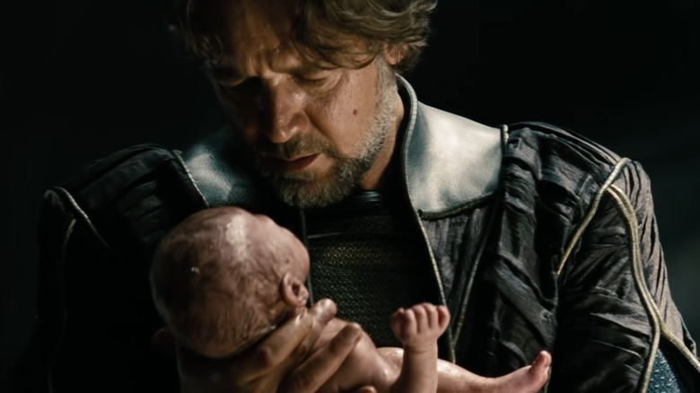 Jor-El holds a newborn