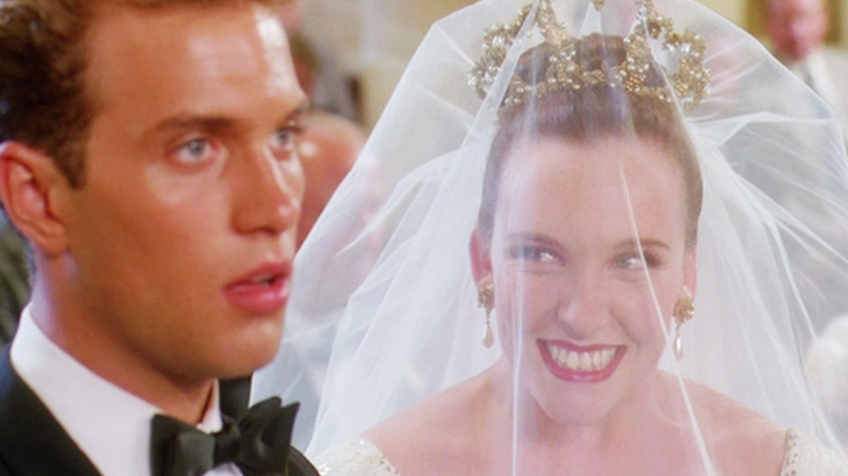 Muriel smiling at David under wedding veil