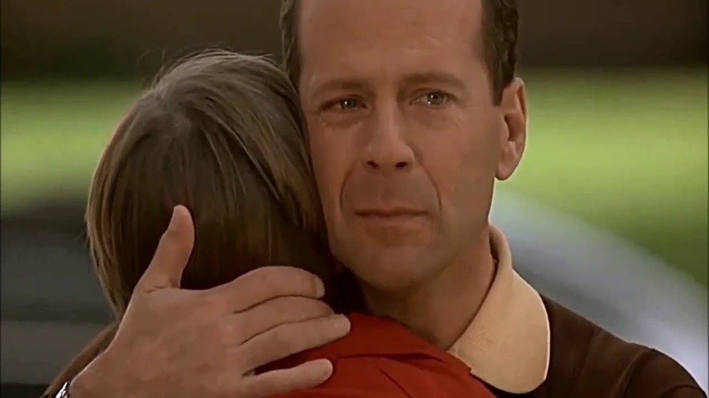 Russ (Bruce Willis) cries as he hugs his younger self in Disney's The Kid