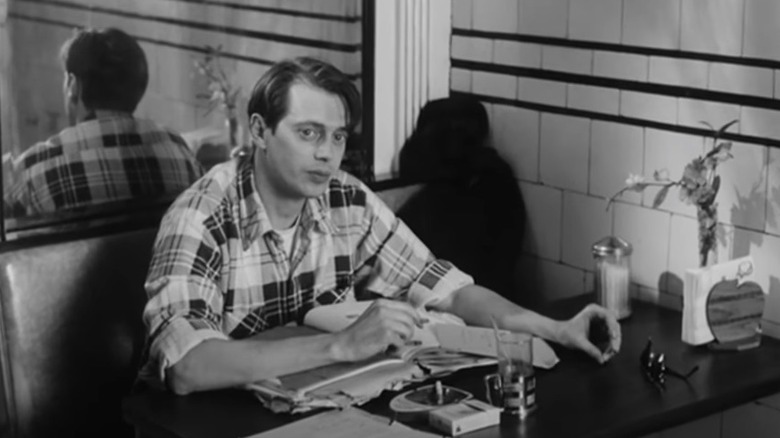 Adolfo sitting at a diner booth