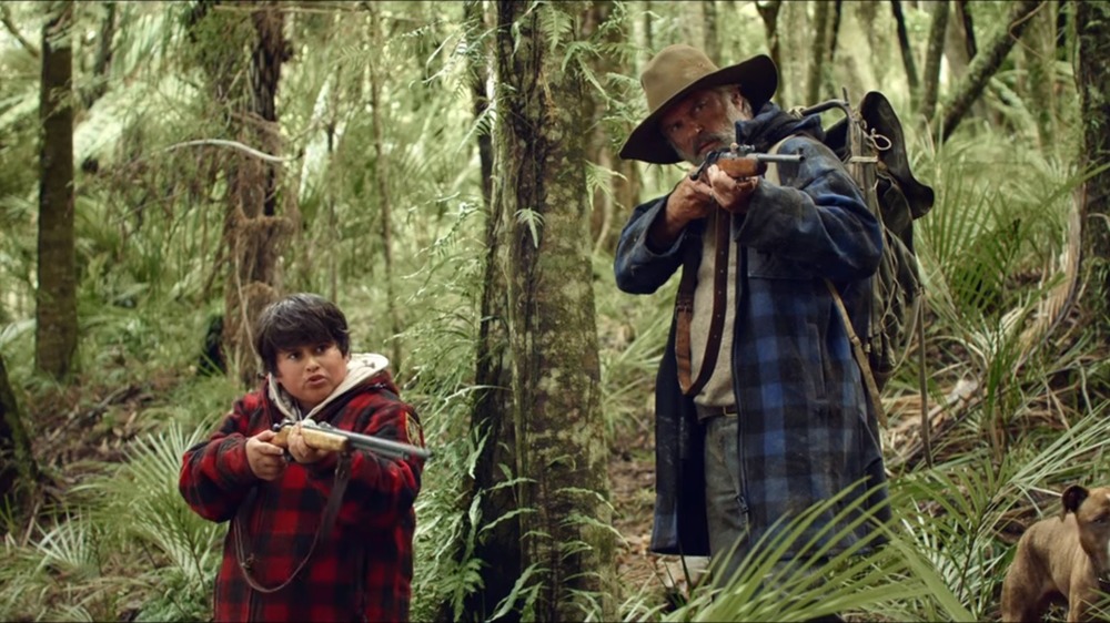 Hunters for the Wilderpeople holding guns